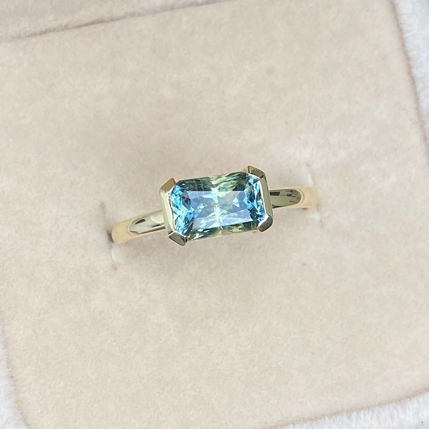 Teal sapphire non traditional engagement ring 